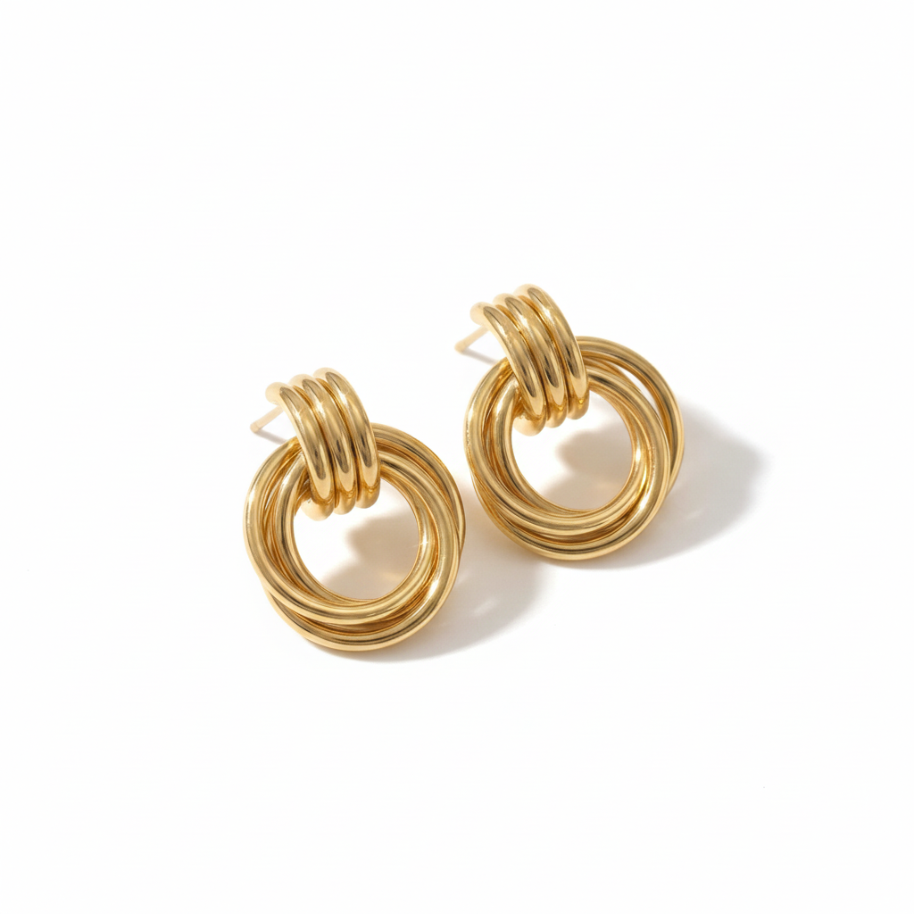 Pair of gold hoop earrings on a white background