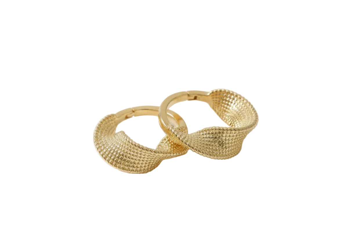 Gold hoop earrings on a white background
